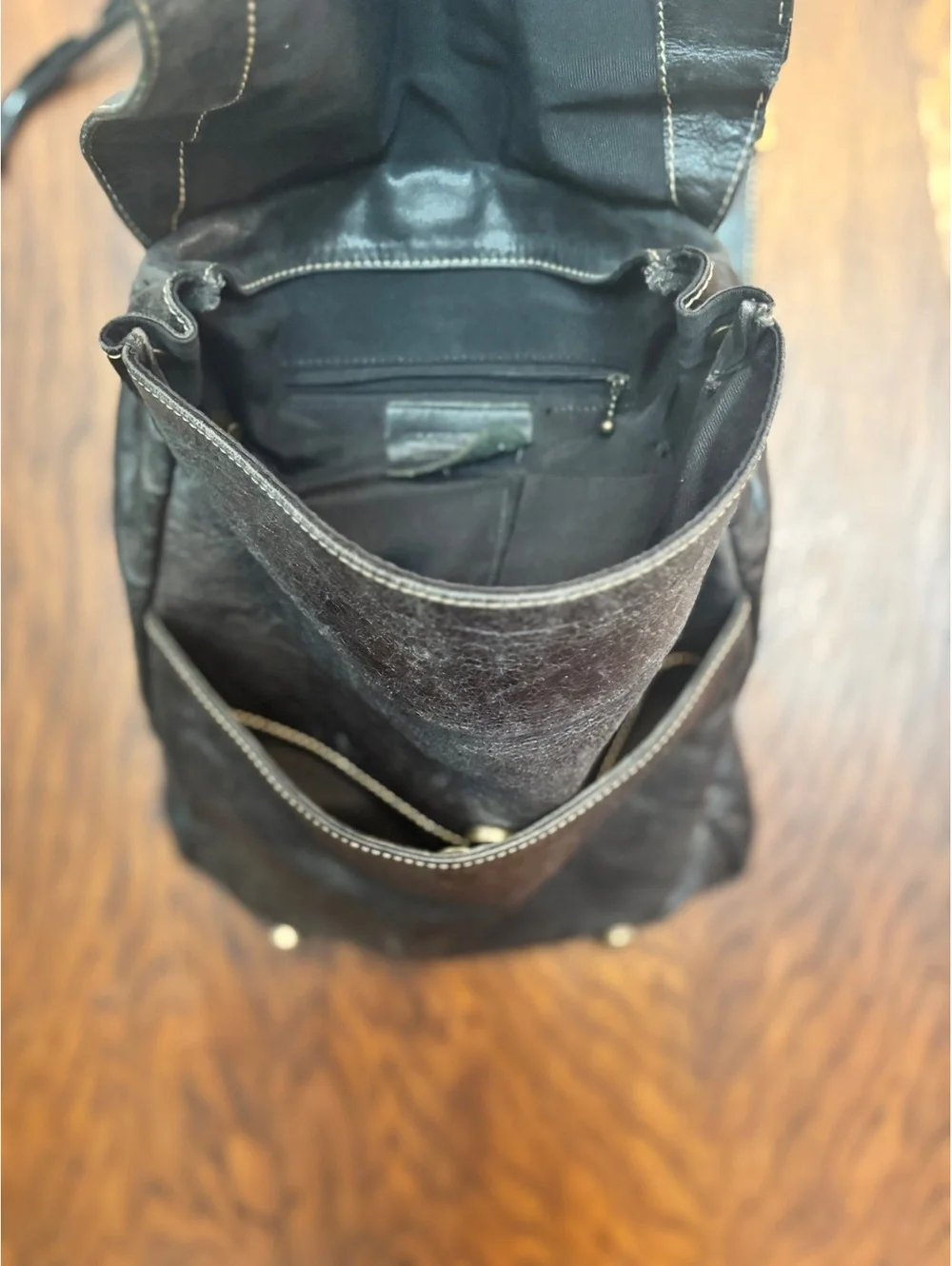 Black Leather Crossbody Backpack with Buckle Closure